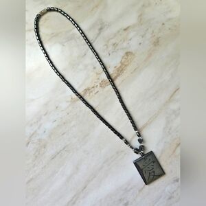 Black Beaded Necklace with Engraved Pendant